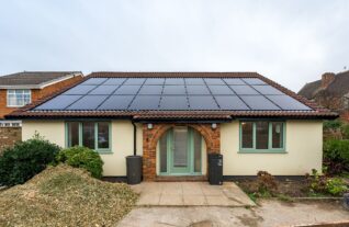 A retrofitted bungalow from the front of the house showing their built in solar panels